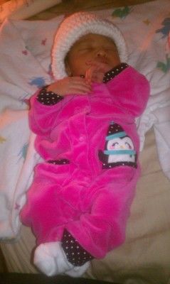Photo of baby in a pink sleeper
